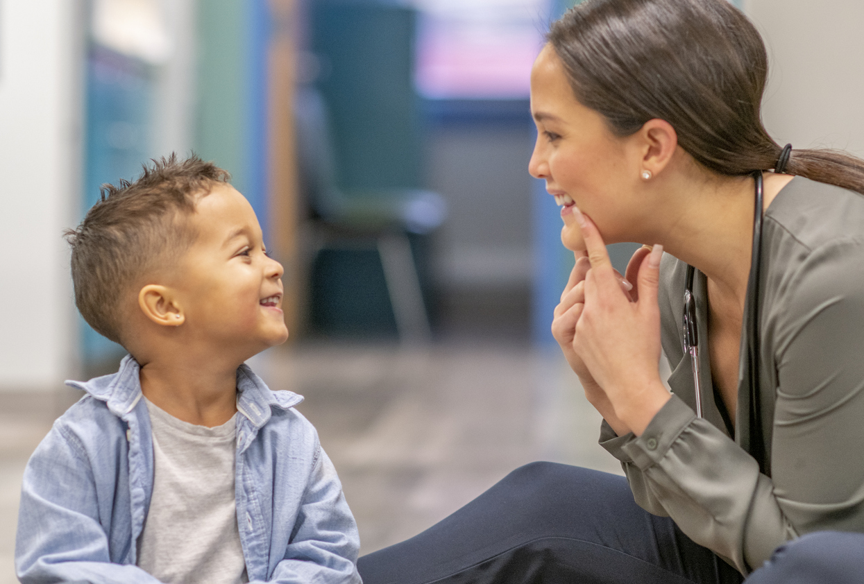 SLP and child smiling